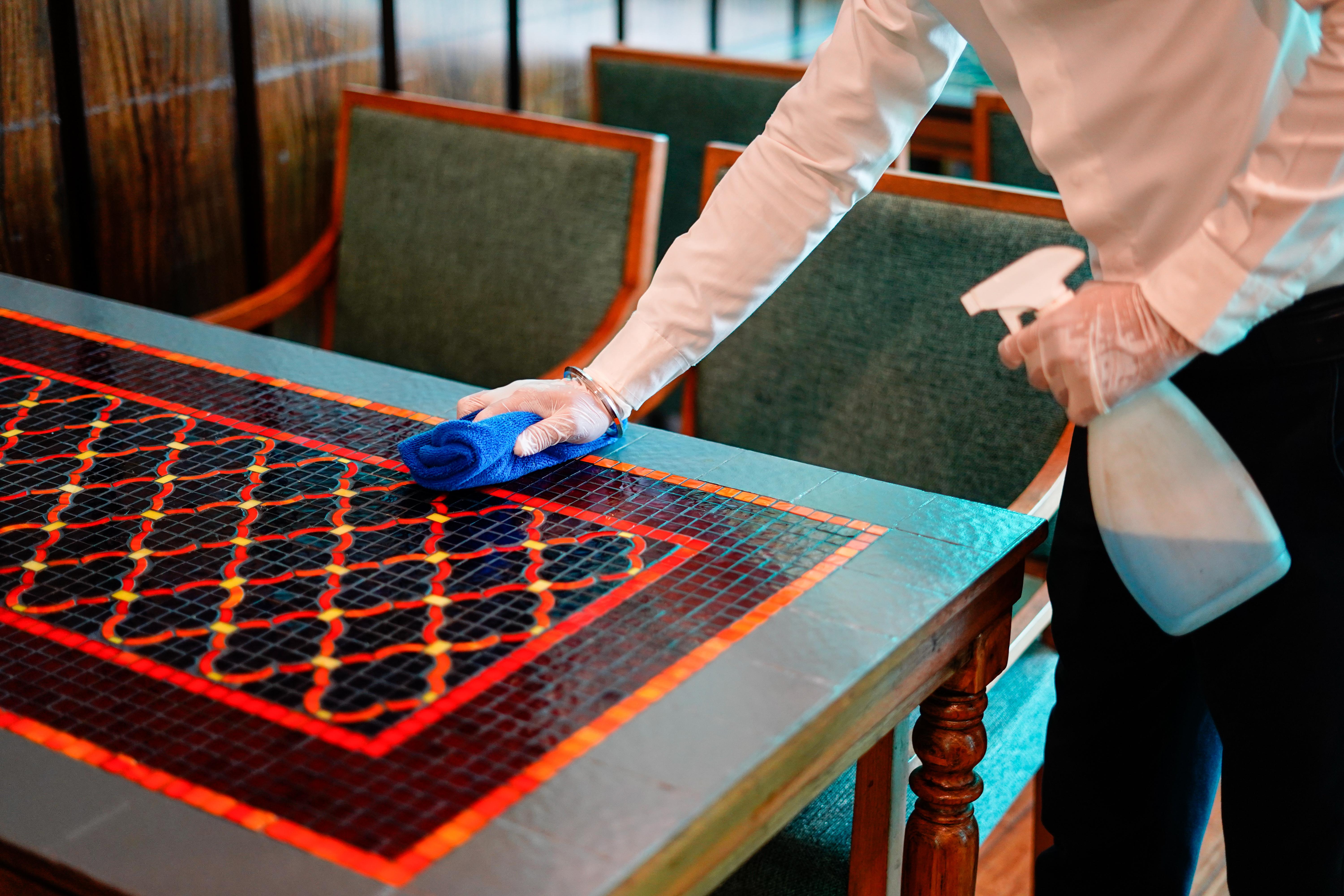 Novotel Goa Resort & Spa Candolim Kültér fotó A hotel housekeeper wiping down a table